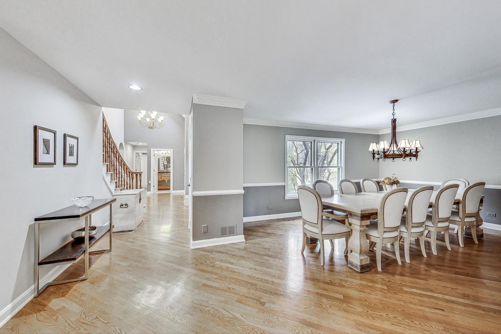 2330 Riverwoods Road Deerfield, IL 60015 - Photo 6 of 50 a dining room with furniture entryway and wooden floor