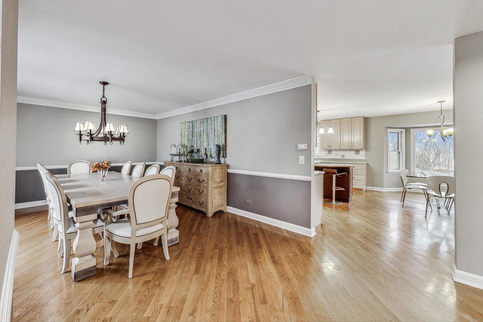 2330 Riverwoods Road Deerfield, IL 60015 - Photo 7 of 50 a view of a dining room with furniture and wooden floor