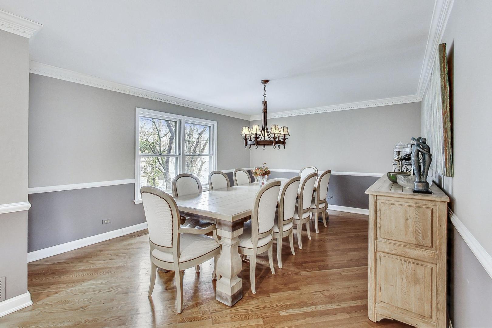 2330 Riverwoods Road Deerfield, IL 60015 - Photo 9 of 50 a view of a dining room with furniture window and wooden floor