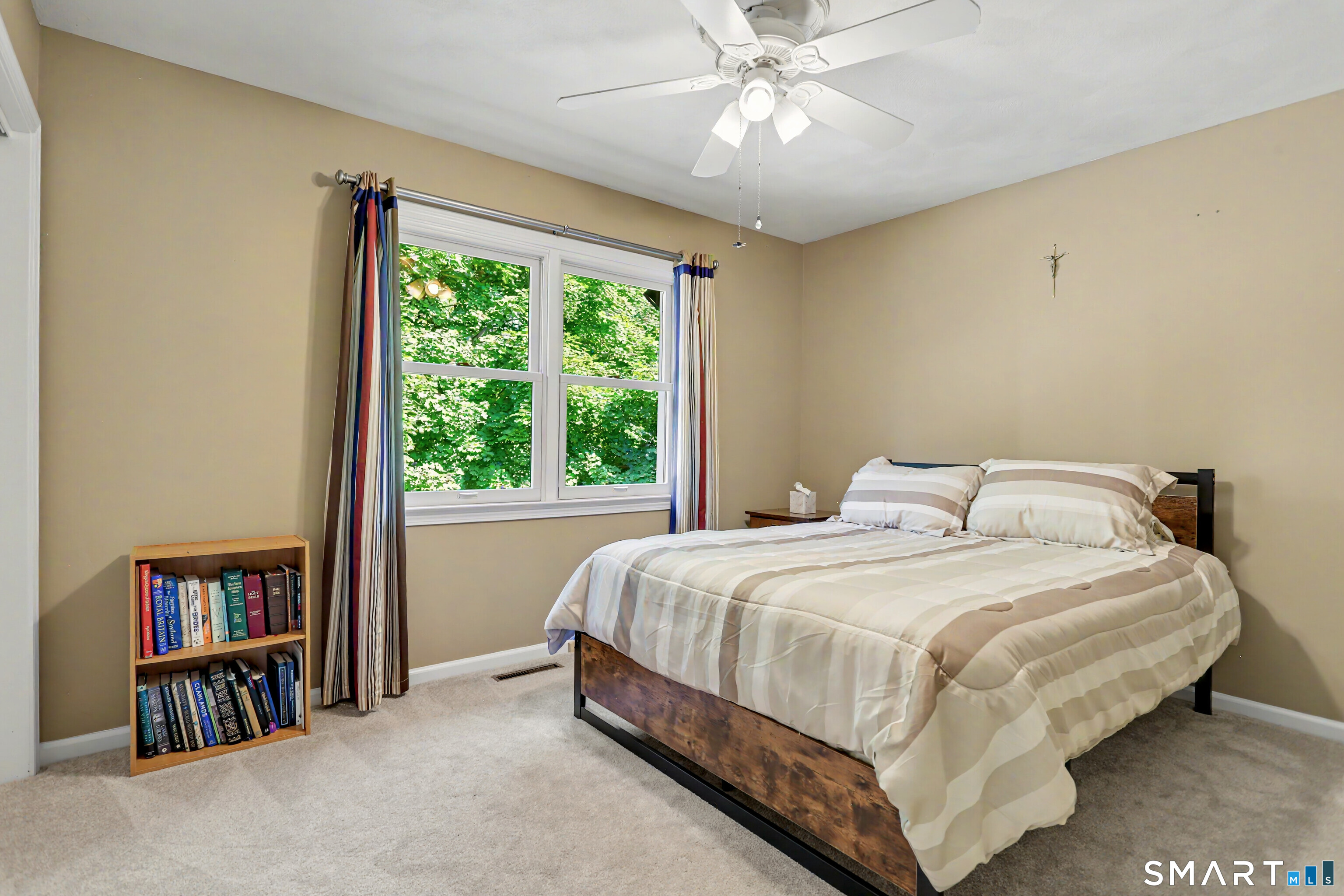 632 Wheelers Farm Road Orange, CT 06477 - Photo 22 of 39 a bedroom with a bed furniture and a large window