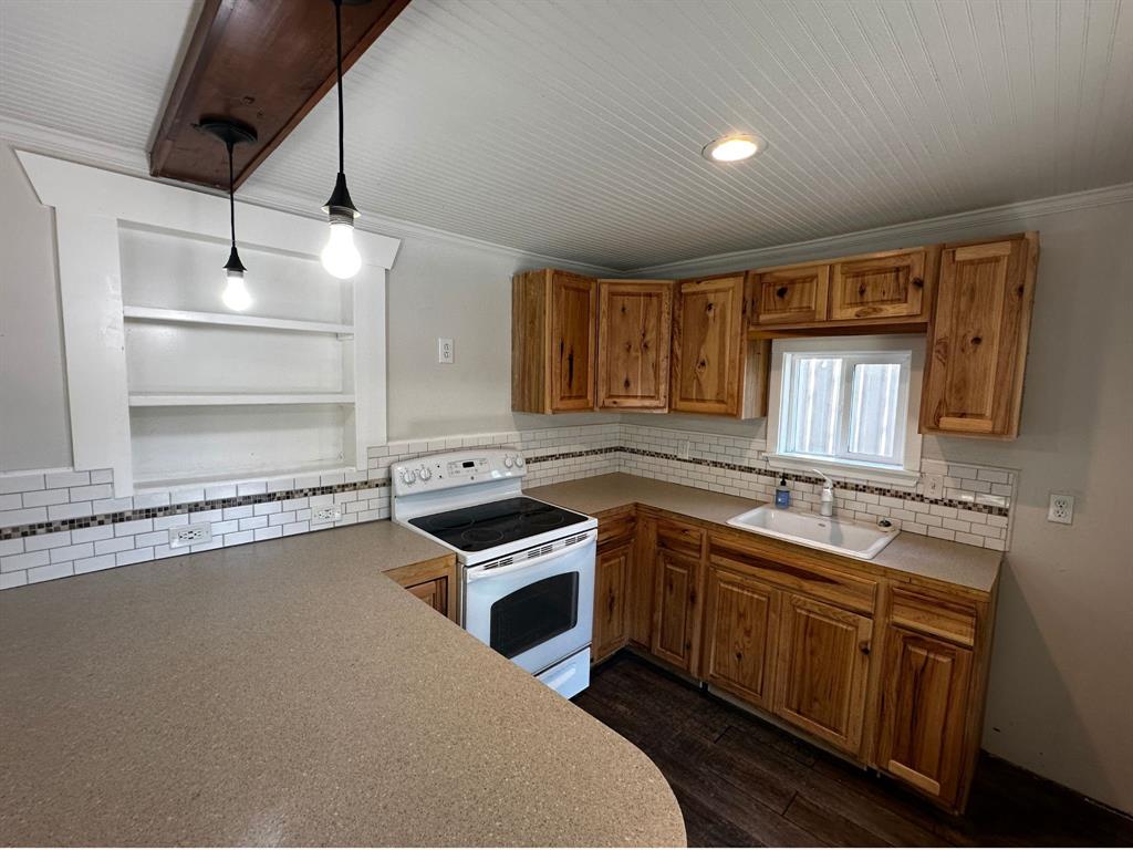 310 Cedar Point Circle Gordonville, TX 76245 - Photo 3 of 9 a kitchen with a sink stove and cabinets