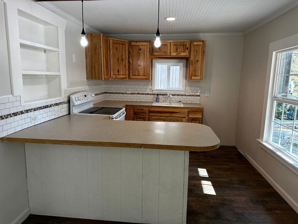 310 Cedar Point Circle Gordonville, TX 76245 - Photo 4 of 9 a kitchen with a sink cabinets and window