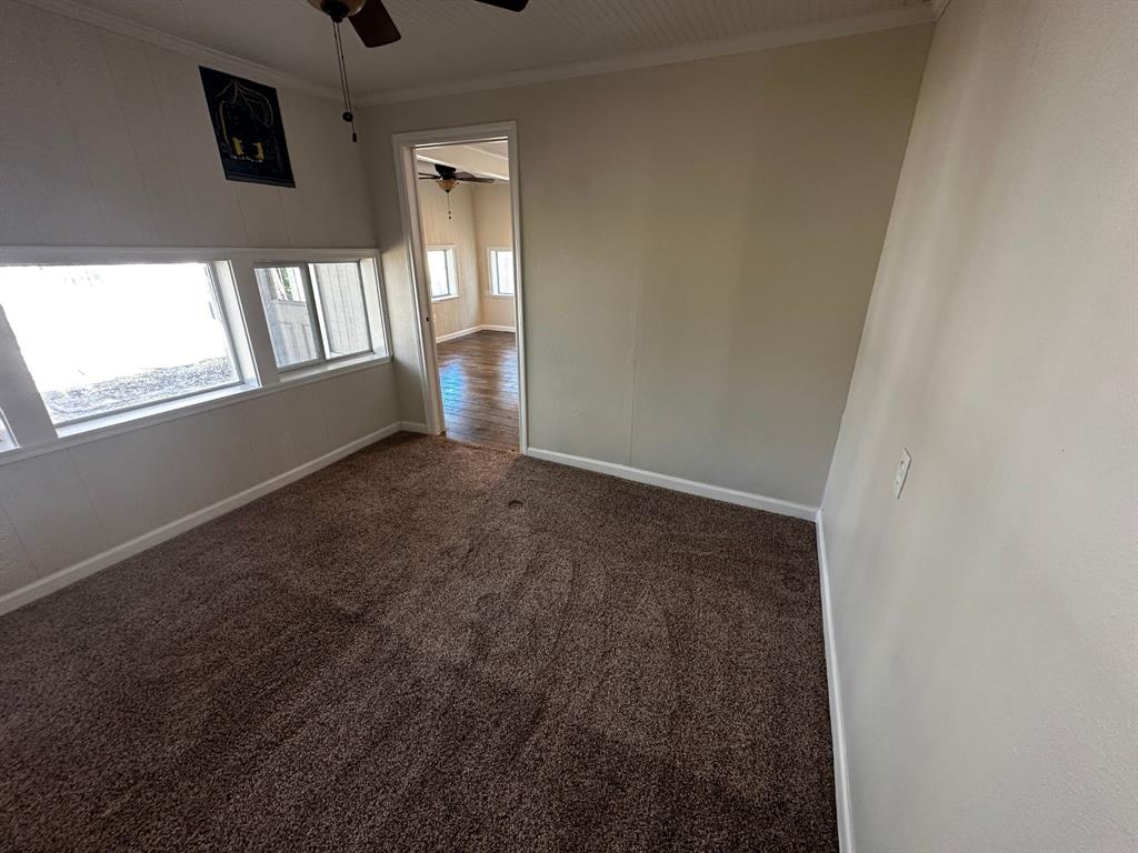310 Cedar Point Circle Gordonville, TX 76245 - Photo 8 of 9 an empty room with windows