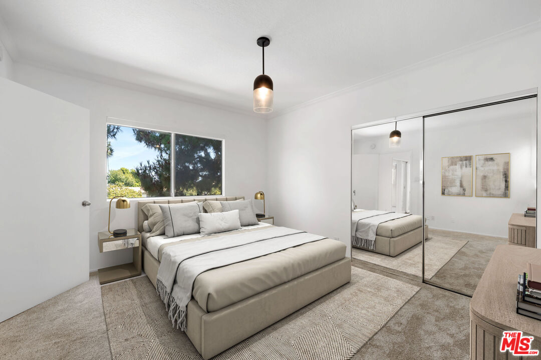 222 7th Street, Unit 301 Santa Monica, CA 90402 - Photo 18 of 55 a bedroom with a bed and window