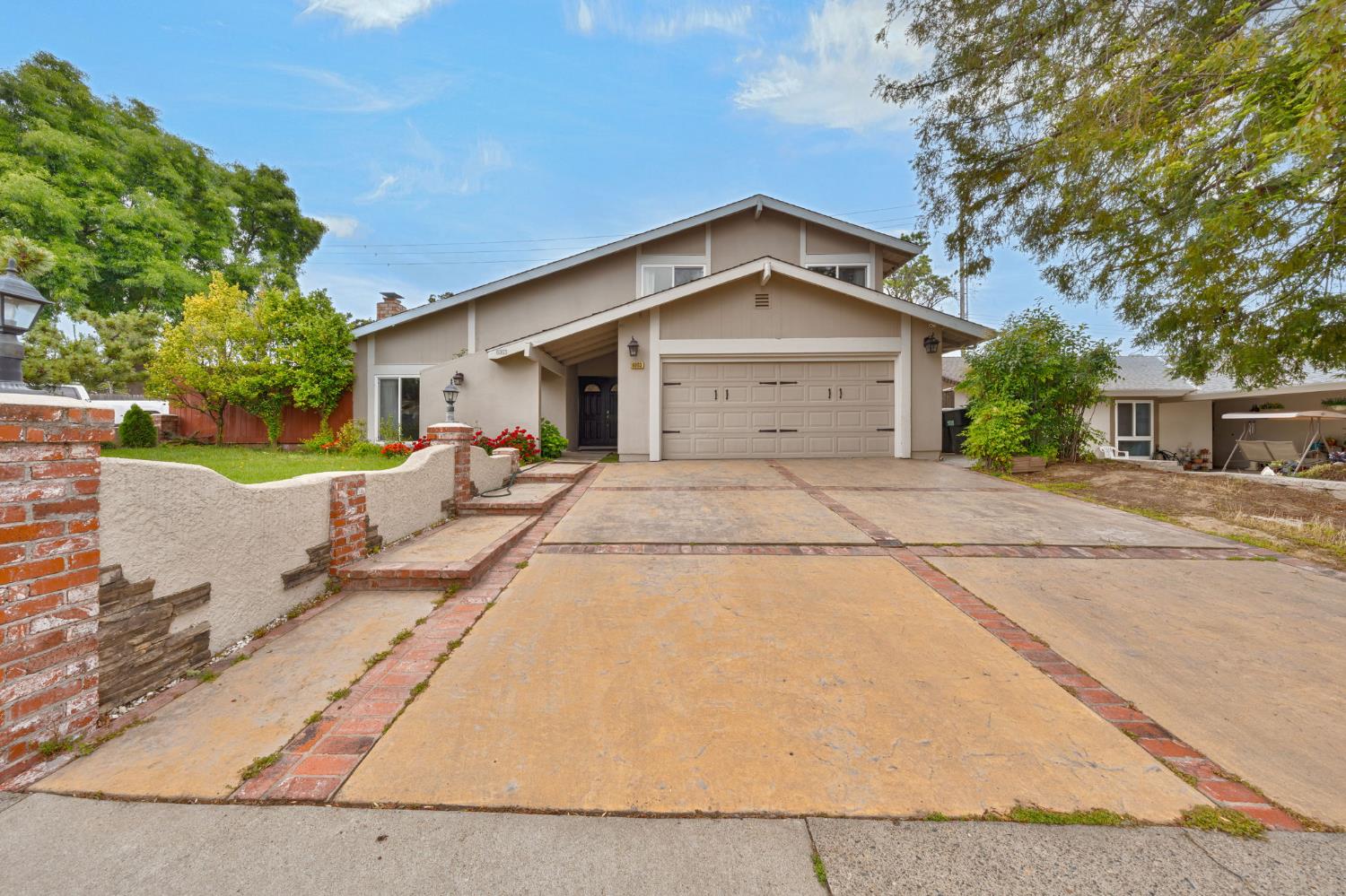 6003 Telesco Way Carmichael, CA 95608 - Photo 2 of 47 a front view of a house with a yard