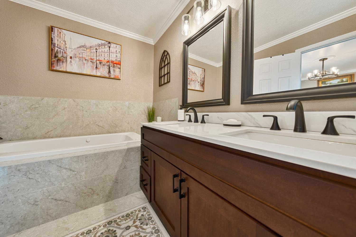 6003 Telesco Way Carmichael, CA 95608 - Photo 21 of 47 a bathroom with a double vanity sink and a bathtub