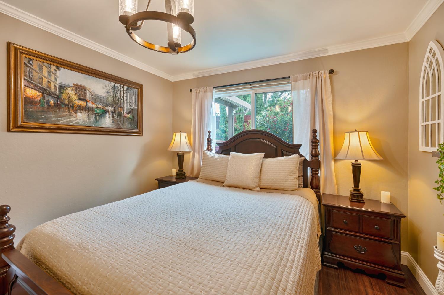 6003 Telesco Way Carmichael, CA 95608 - Photo 32 of 47 a bedroom with a bed and a painting on the wall