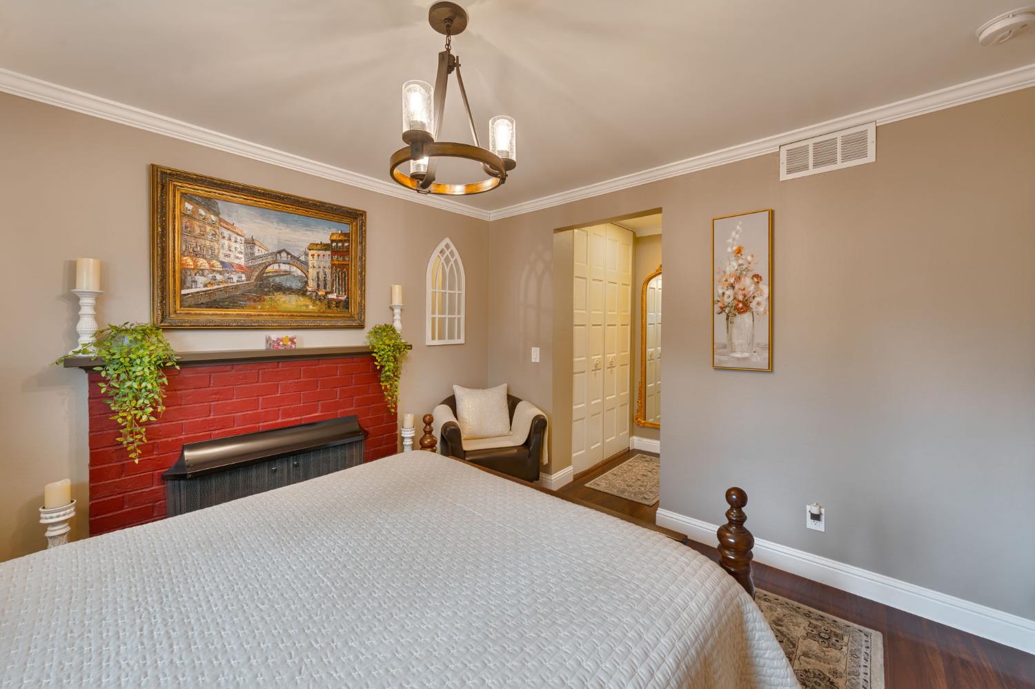6003 Telesco Way Carmichael, CA 95608 - Photo 34 of 47 a bedroom with a bed and a chandelier