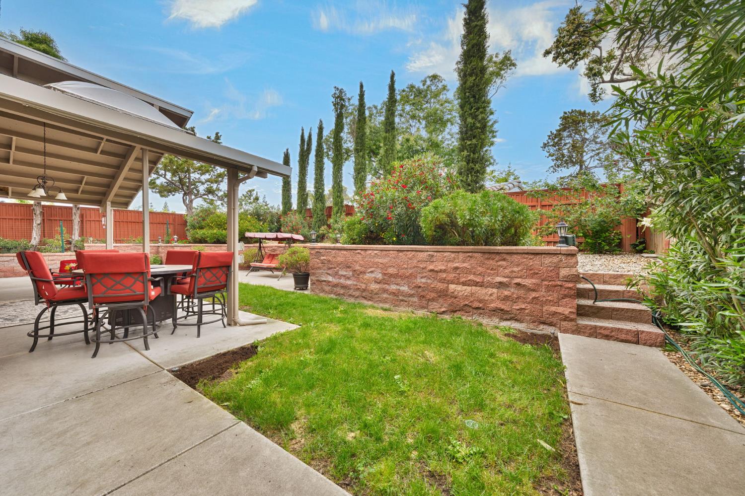 6003 Telesco Way Carmichael, CA 95608 - Photo 40 of 47 a view of a patio with a table and chairs