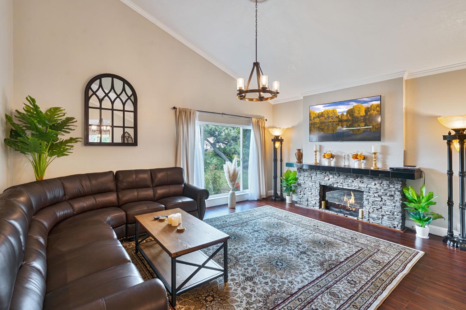 6003 Telesco Way Carmichael, CA 95608 - Photo 5 of 47 a living room with furniture a fireplace and a flat screen tv