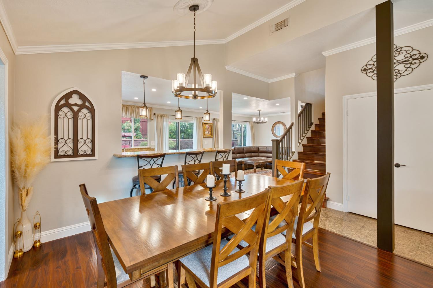 6003 Telesco Way Carmichael, CA 95608 - Photo 8 of 47 a view of a dining room with furniture wooden floor and chandelier