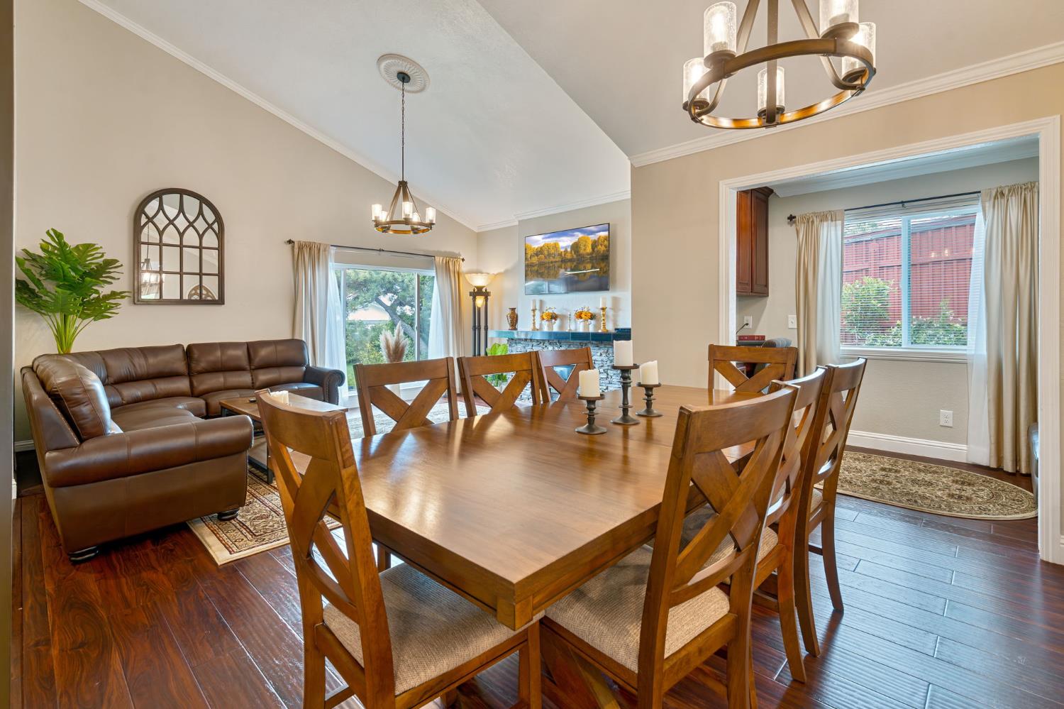 6003 Telesco Way Carmichael, CA 95608 - Photo 9 of 47 a dining room with wooden floor a chandelier a wooden table and chairs