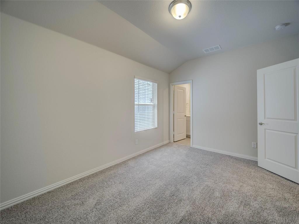3405 Kingsgarden Road Denton, TX 76207 - Photo 22 of 37 an empty room with windows and closet