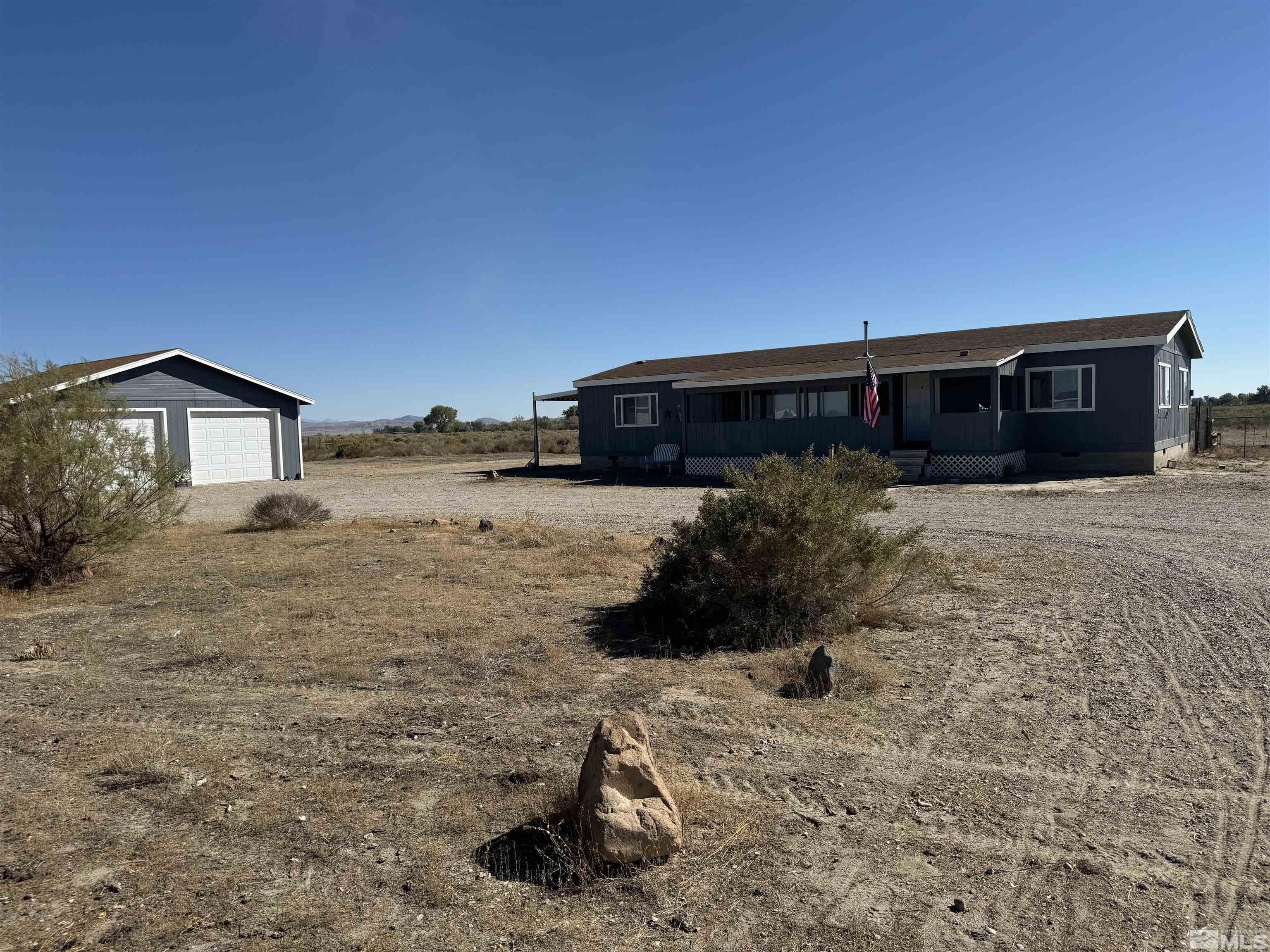 5500 Mission Road Fallon, NV 89406 - Photo 1 of 15 a front view of a house with a yard