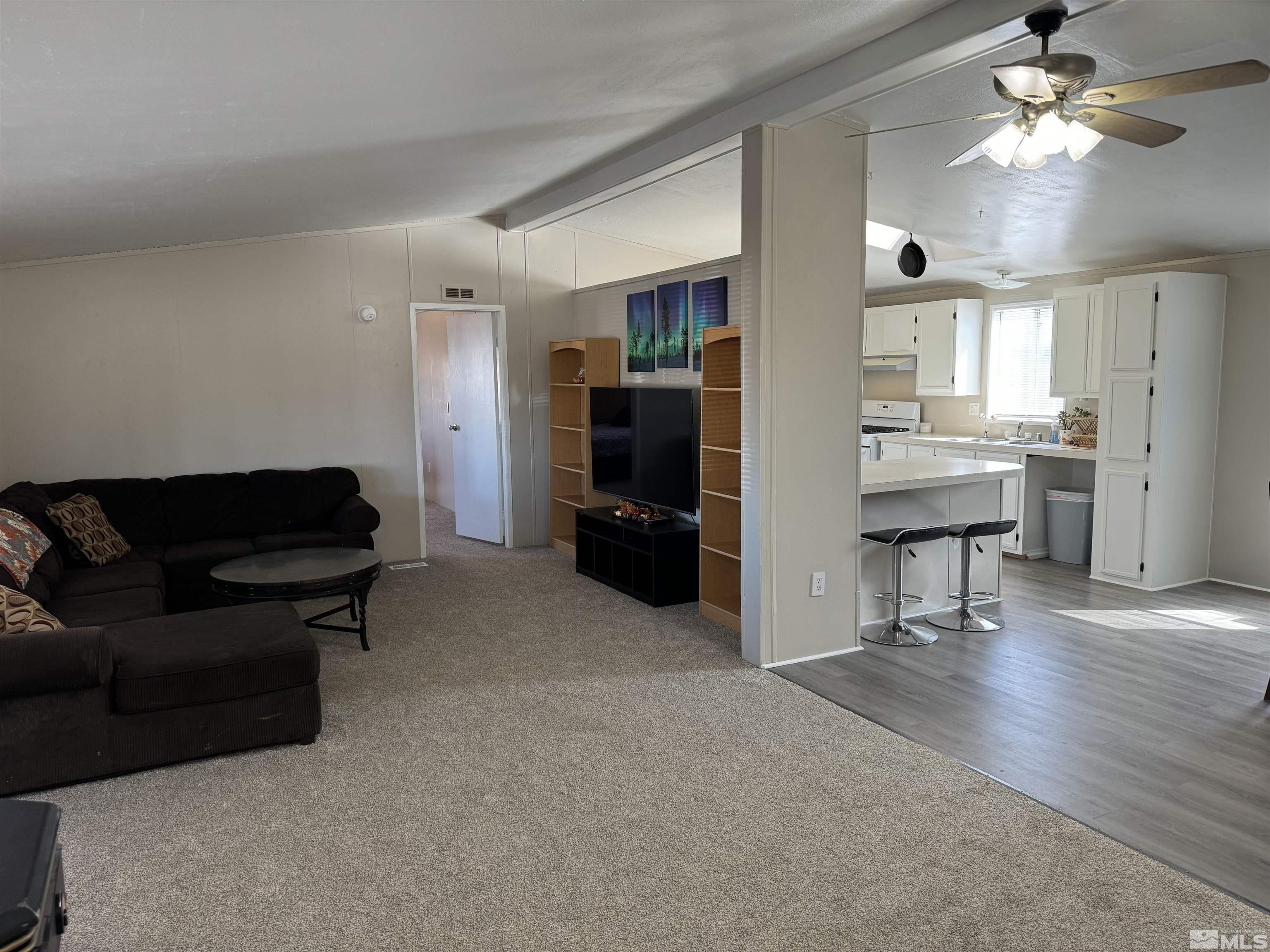 5500 Mission Road Fallon, NV 89406 - Photo 2 of 15 a living room with furniture and wooden floor
