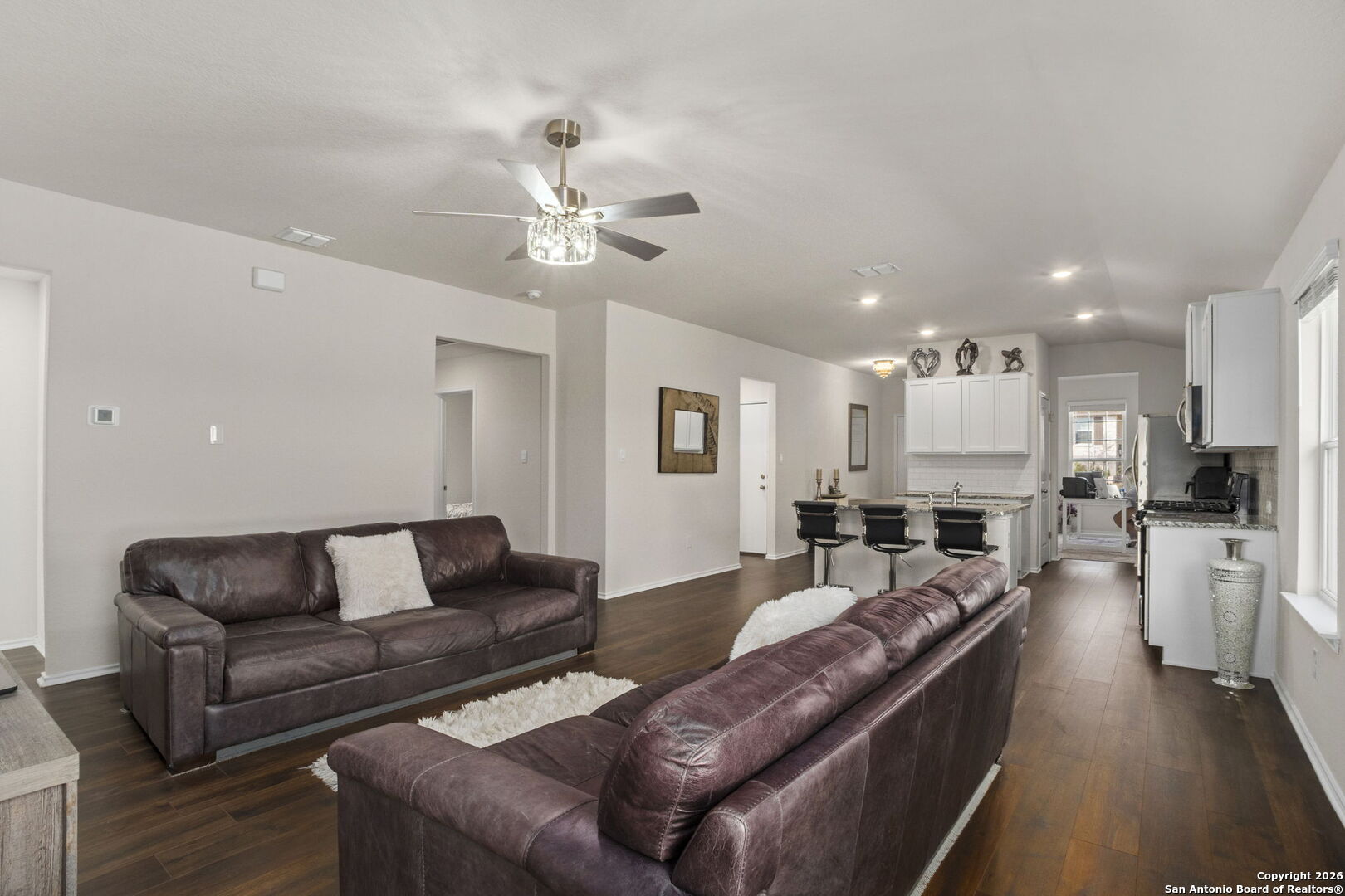 3658 Copper Willow Bulverde, TX 78163 - Photo 11 of 27 a living room with furniture and kitchen view