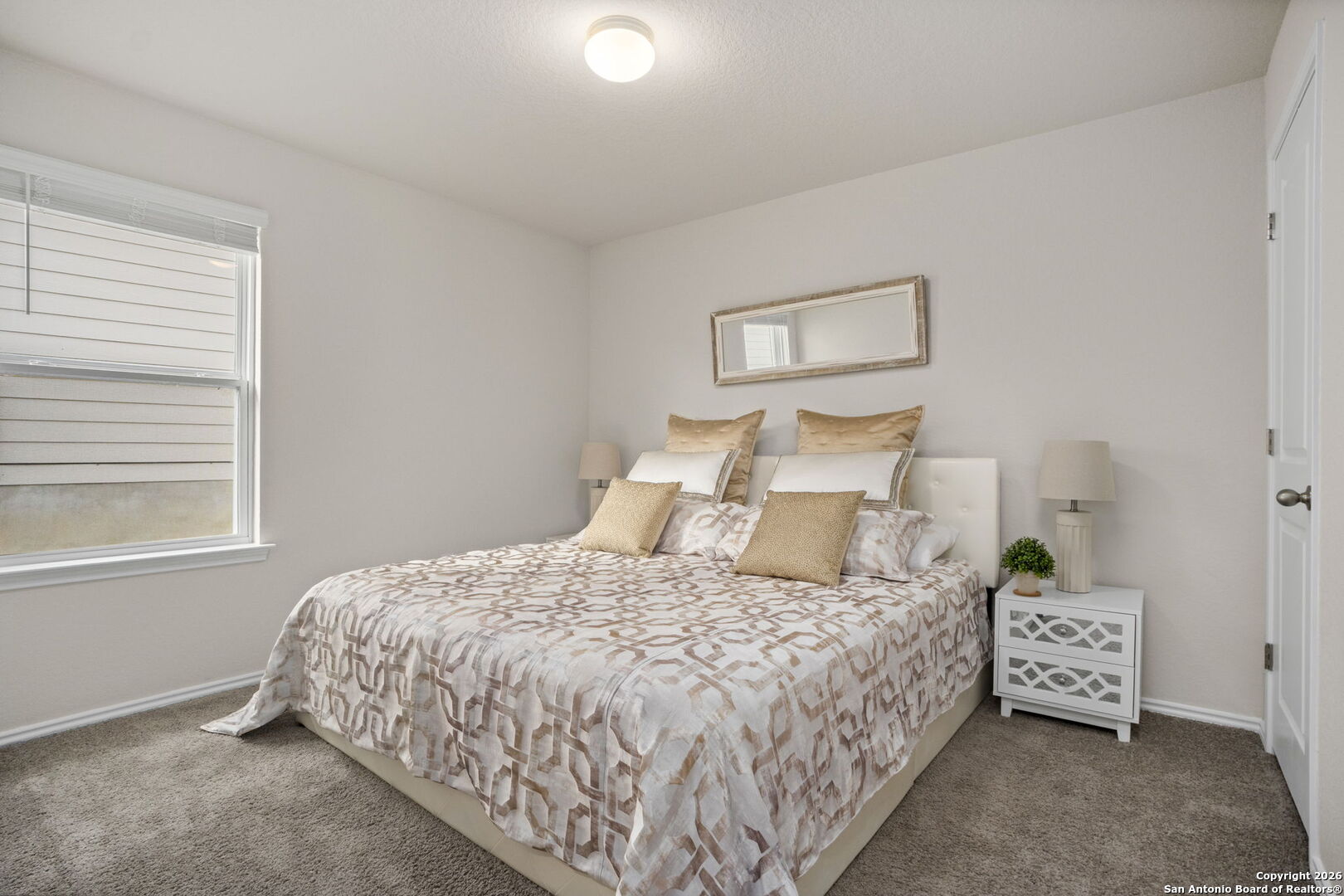 3658 Copper Willow Bulverde, TX 78163 - Photo 14 of 27 a bedroom with a bed and a window
