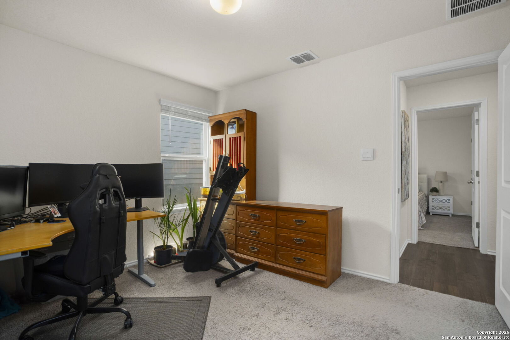 3658 Copper Willow Bulverde, TX 78163 - Photo 22 of 27 a bedroom with furniture and a gym equipment