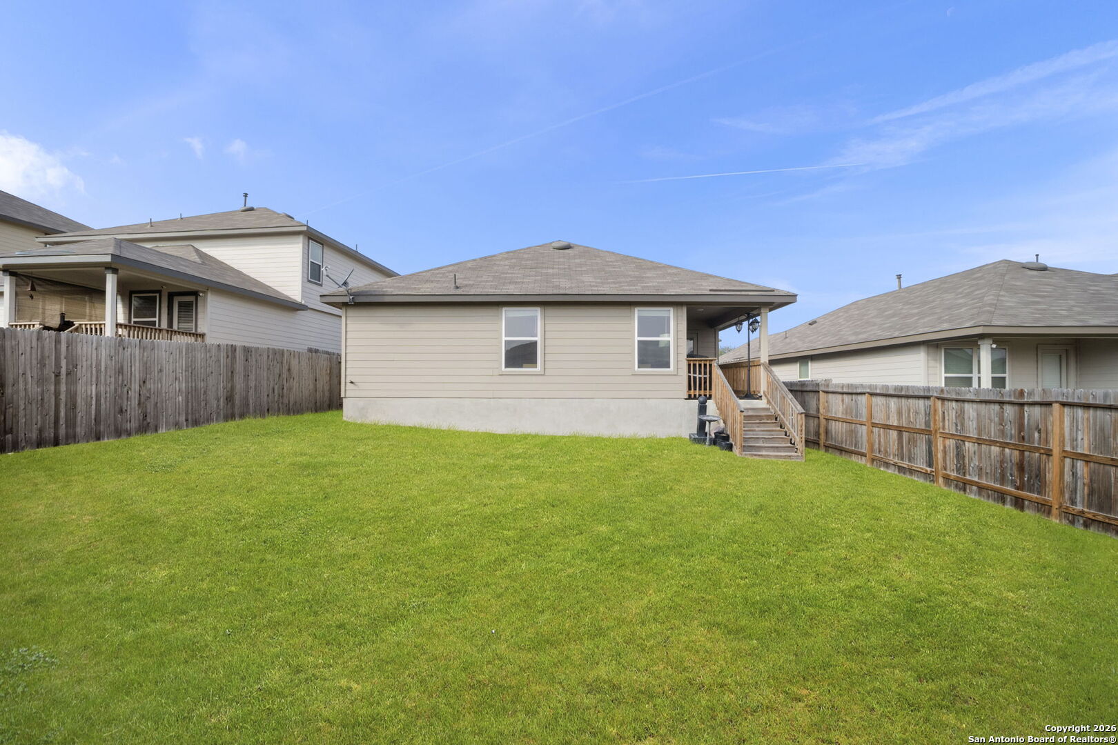 3658 Copper Willow Bulverde, TX 78163 - Photo 24 of 27 a view of a house with a yard and wooden fence