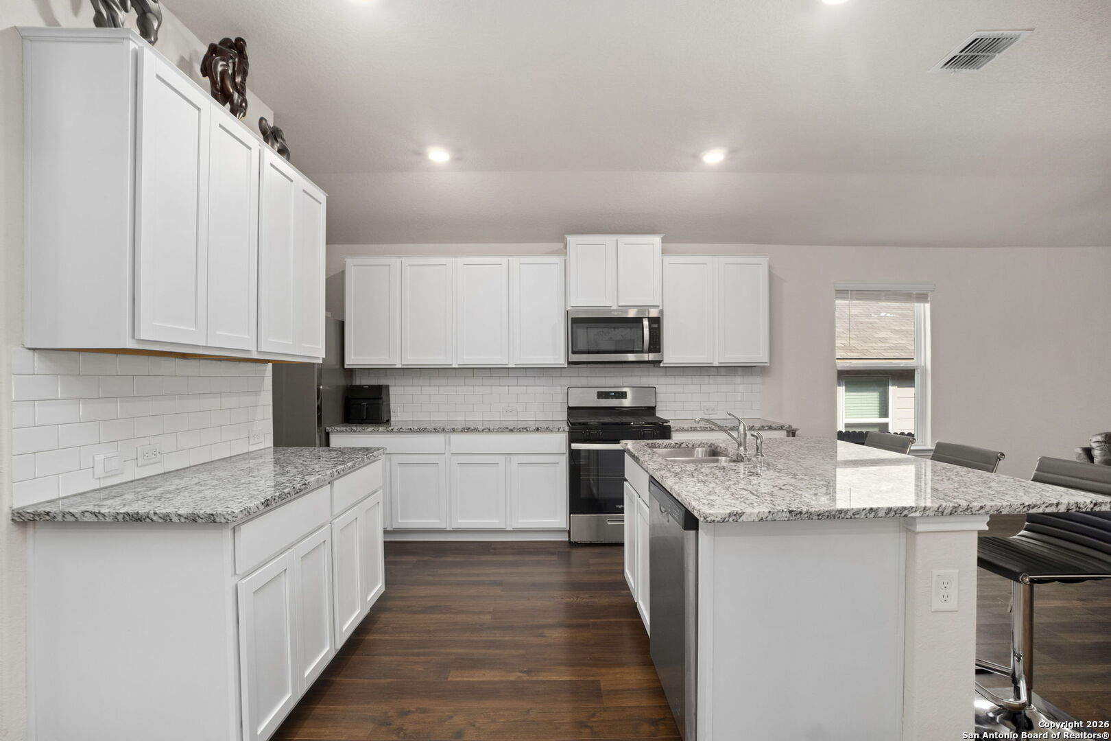 3658 Copper Willow Bulverde, TX 78163 - Photo 8 of 27 a kitchen with appliances a sink and cabinets