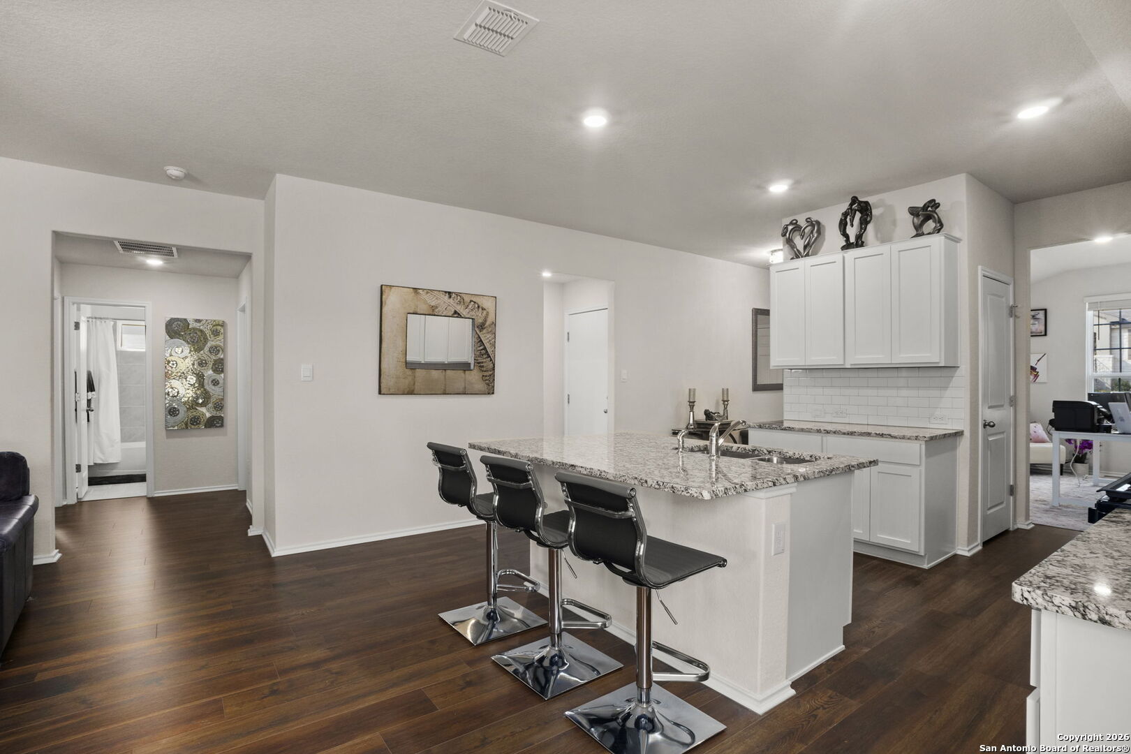 3658 Copper Willow Bulverde, TX 78163 - Photo 10 of 27 a view of a kitchen with dining table and chairs