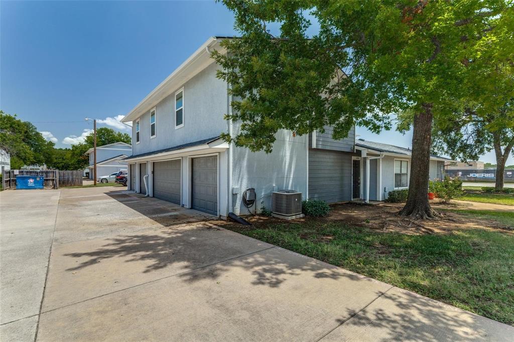 606 Ridgeline Drive Hurst, TX 76053 - Photo 17 of 29 a front view of a house with a yard and trees
