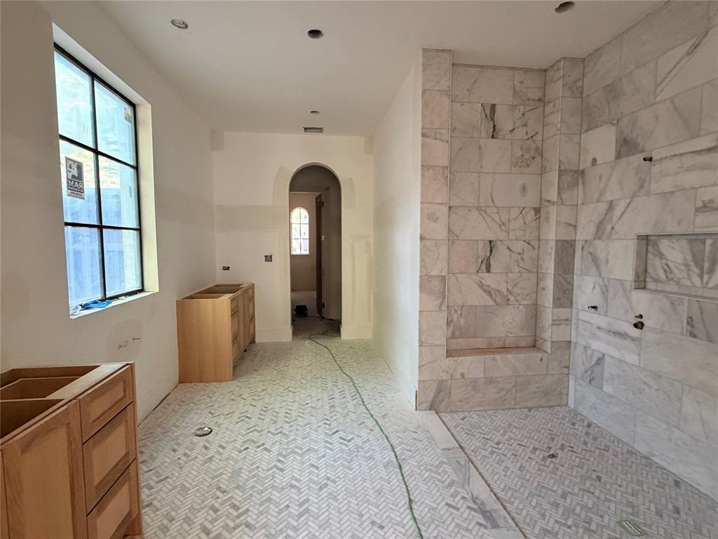 3830 Dunhaven Road Dallas, TX 75220 - Photo 14 of 21 a spacious bathroom with a granite countertop sink a toilet and bathtub