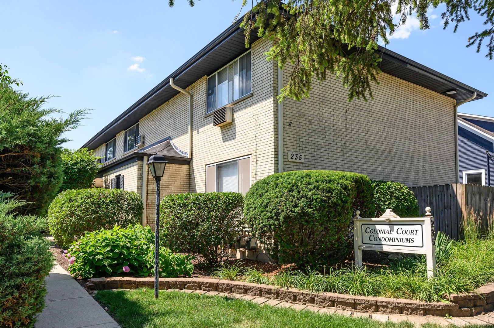 235 East Palatine Road, Unit 1C Palatine, IL 60067 - Photo 1 of 13 a sign that is on the side of a building