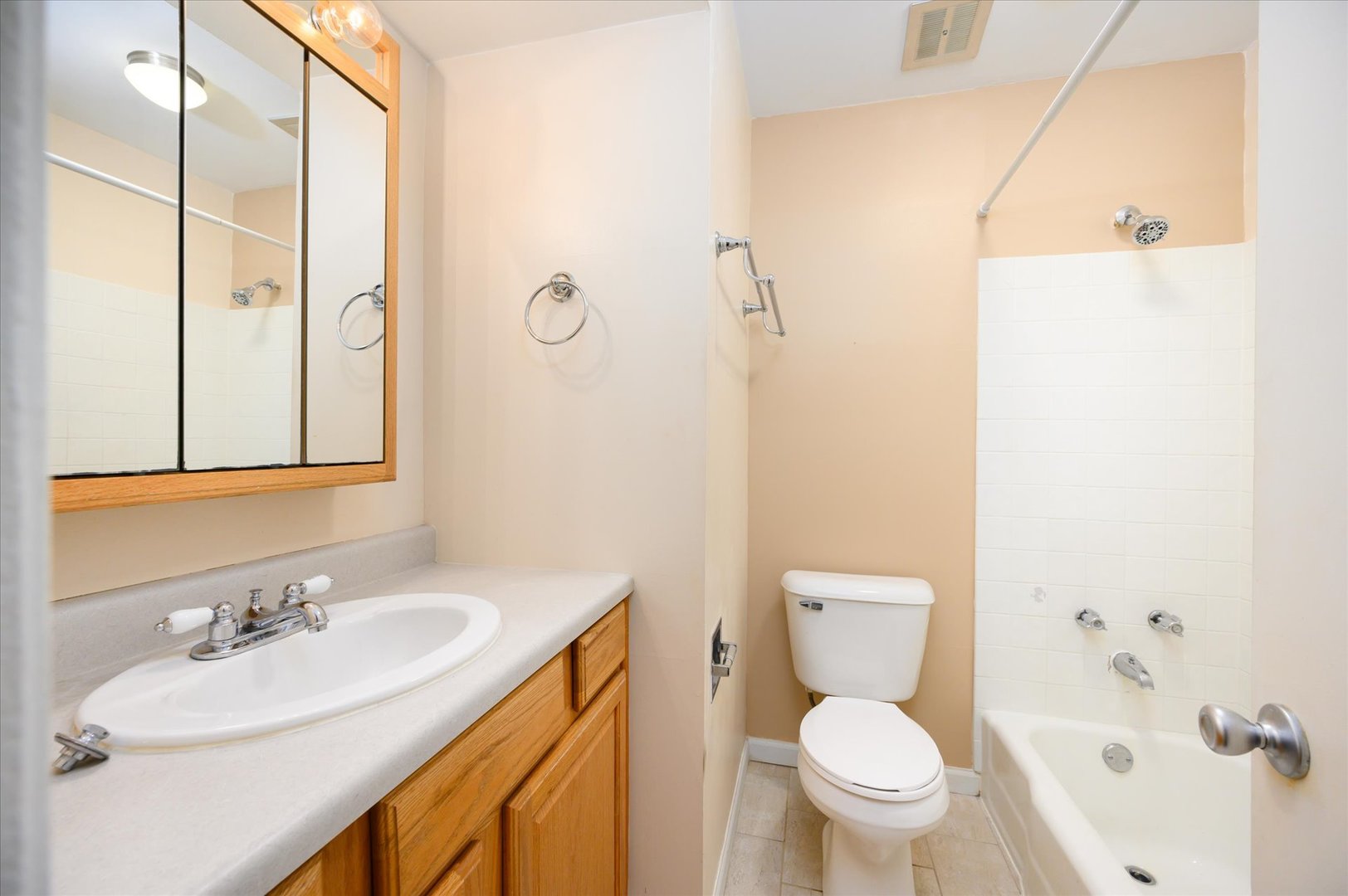 235 East Palatine Road, Unit 1C Palatine, IL 60067 - Photo 7 of 13 a bathroom with a sink toilet and shower