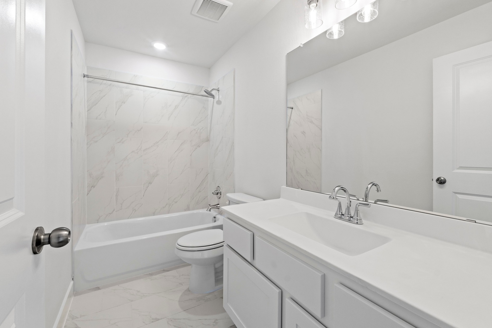 604 Lightstone Drive Georgetown, TX 78633 - Photo 23 of 39 a bathroom with a sink a toilet and shower