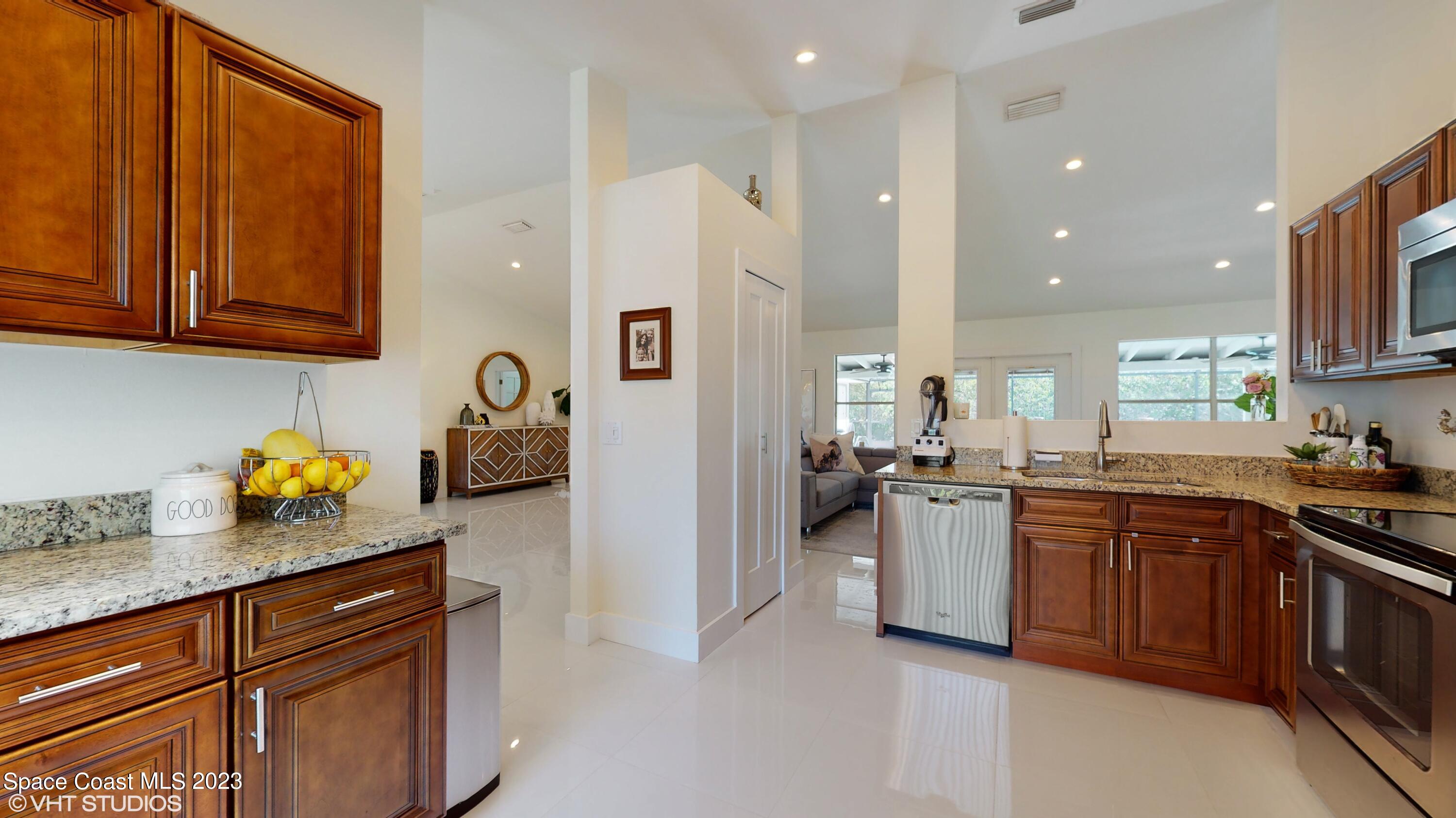 1650 Benjamin Road Malabar, FL 32950 - Photo 11 of 34 a kitchen with a sink stove and cabinets