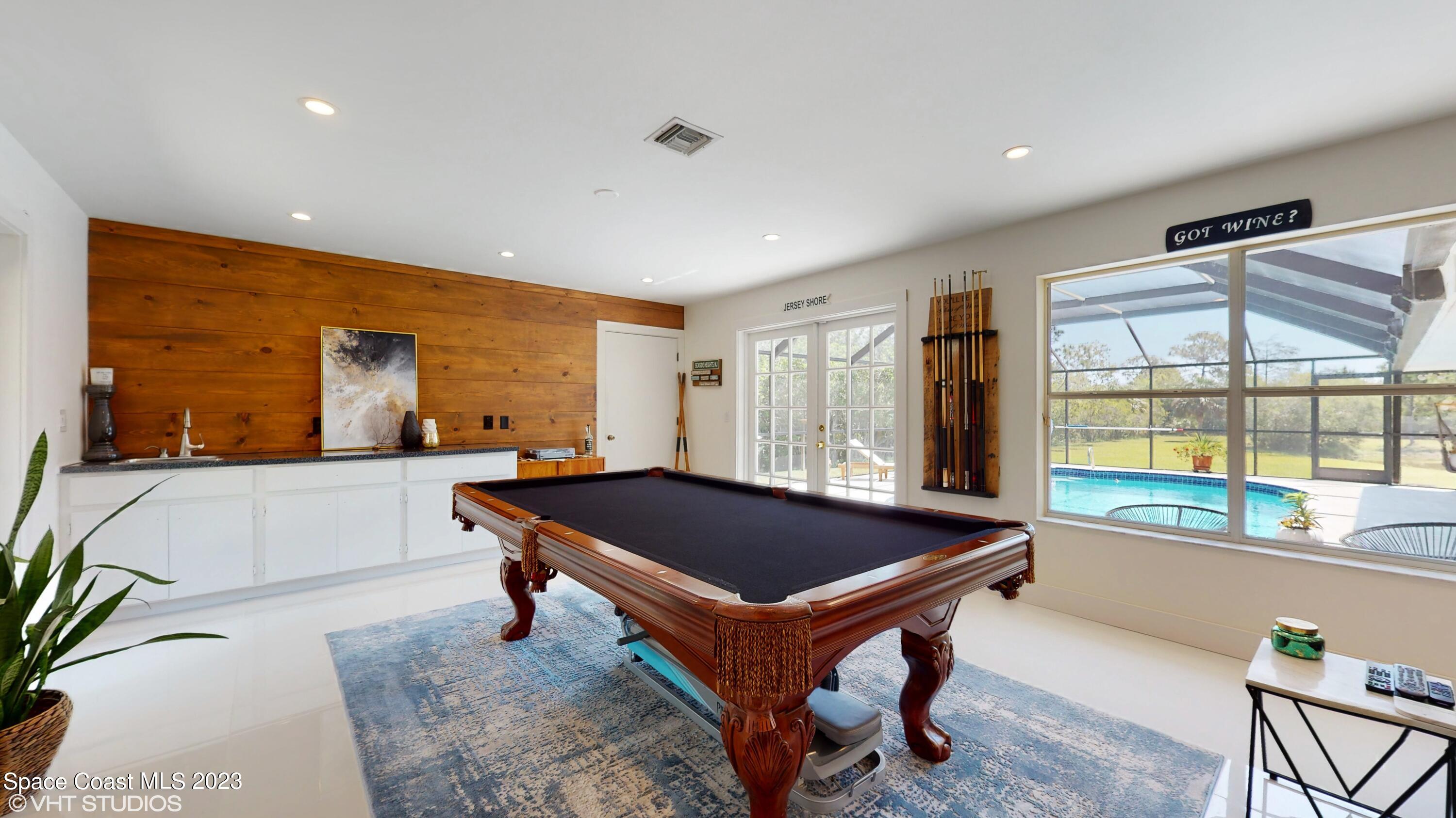 1650 Benjamin Road Malabar, FL 32950 - Photo 15 of 34 a room with furniture pool table and windows