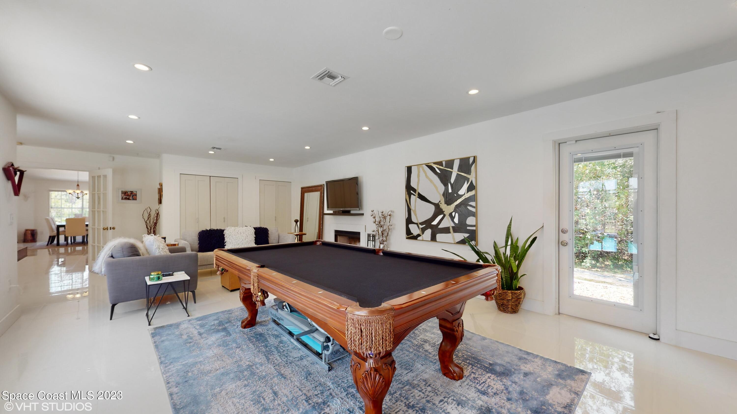 1650 Benjamin Road Malabar, FL 32950 - Photo 16 of 34 a living room with furniture and a table