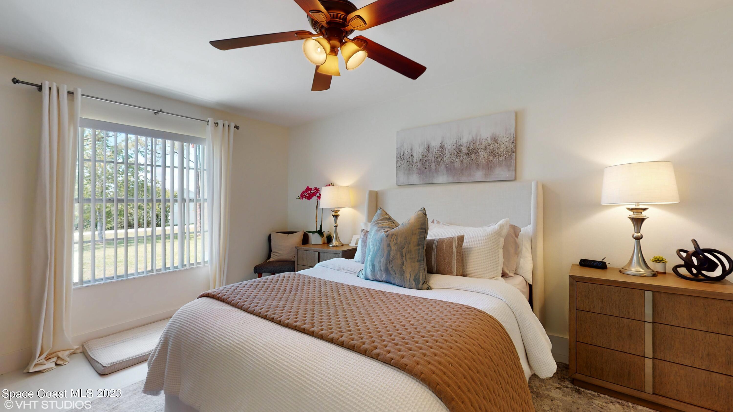 1650 Benjamin Road Malabar, FL 32950 - Photo 18 of 34 a bedroom with a bed and a window