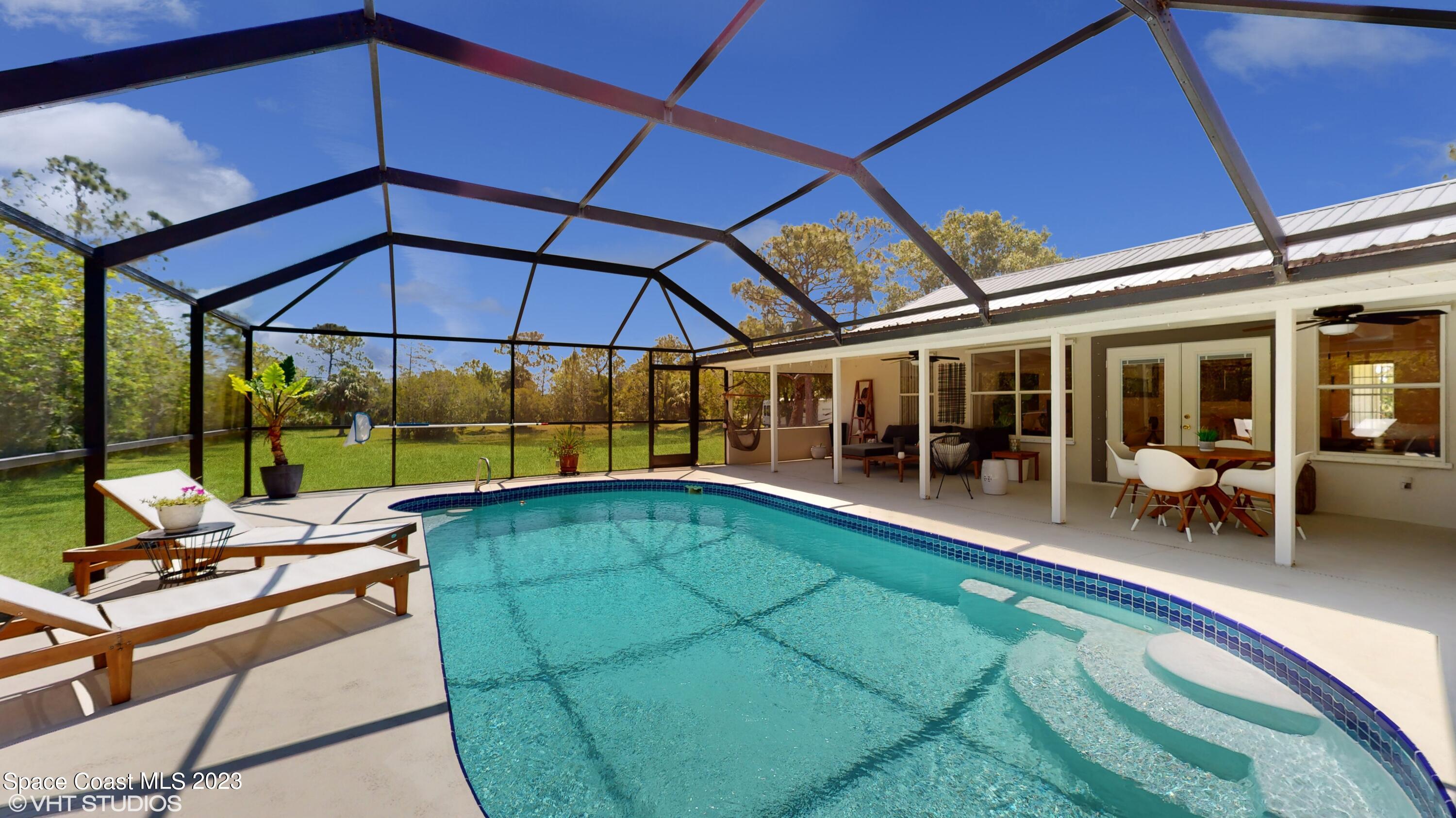 1650 Benjamin Road Malabar, FL 32950 - Photo 26 of 34 a view of a swimming pool with a patio