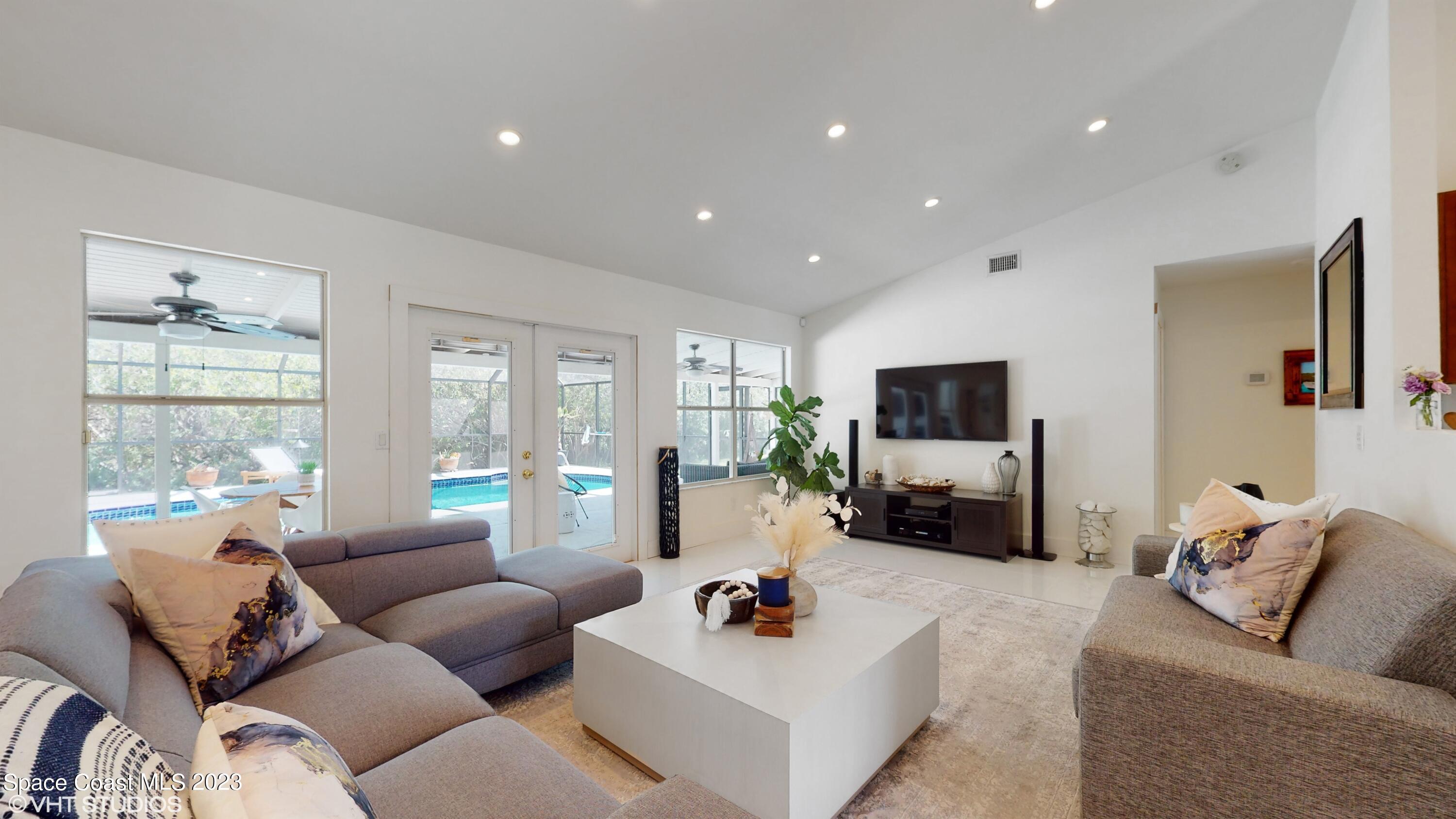 1650 Benjamin Road Malabar, FL 32950 - Photo 5 of 34 a living room with furniture and a flat screen tv