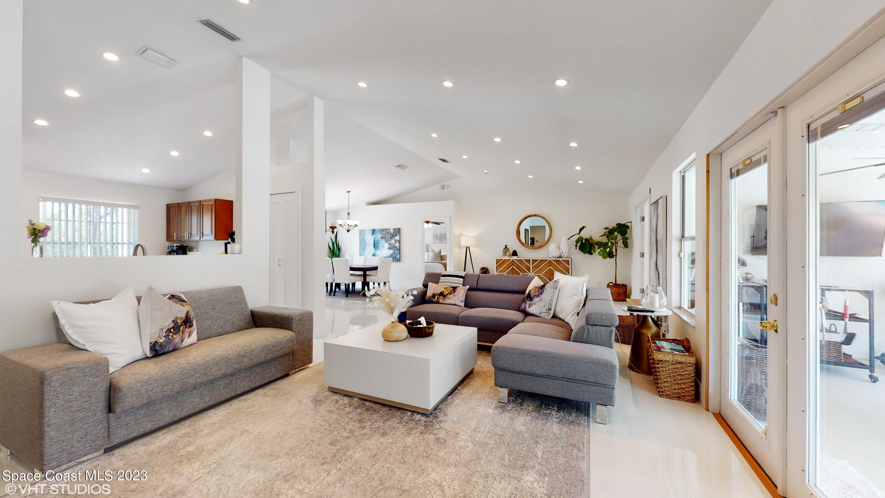 1650 Benjamin Road Malabar, FL 32950 - Photo 6 of 34 a living room with furniture and a couch