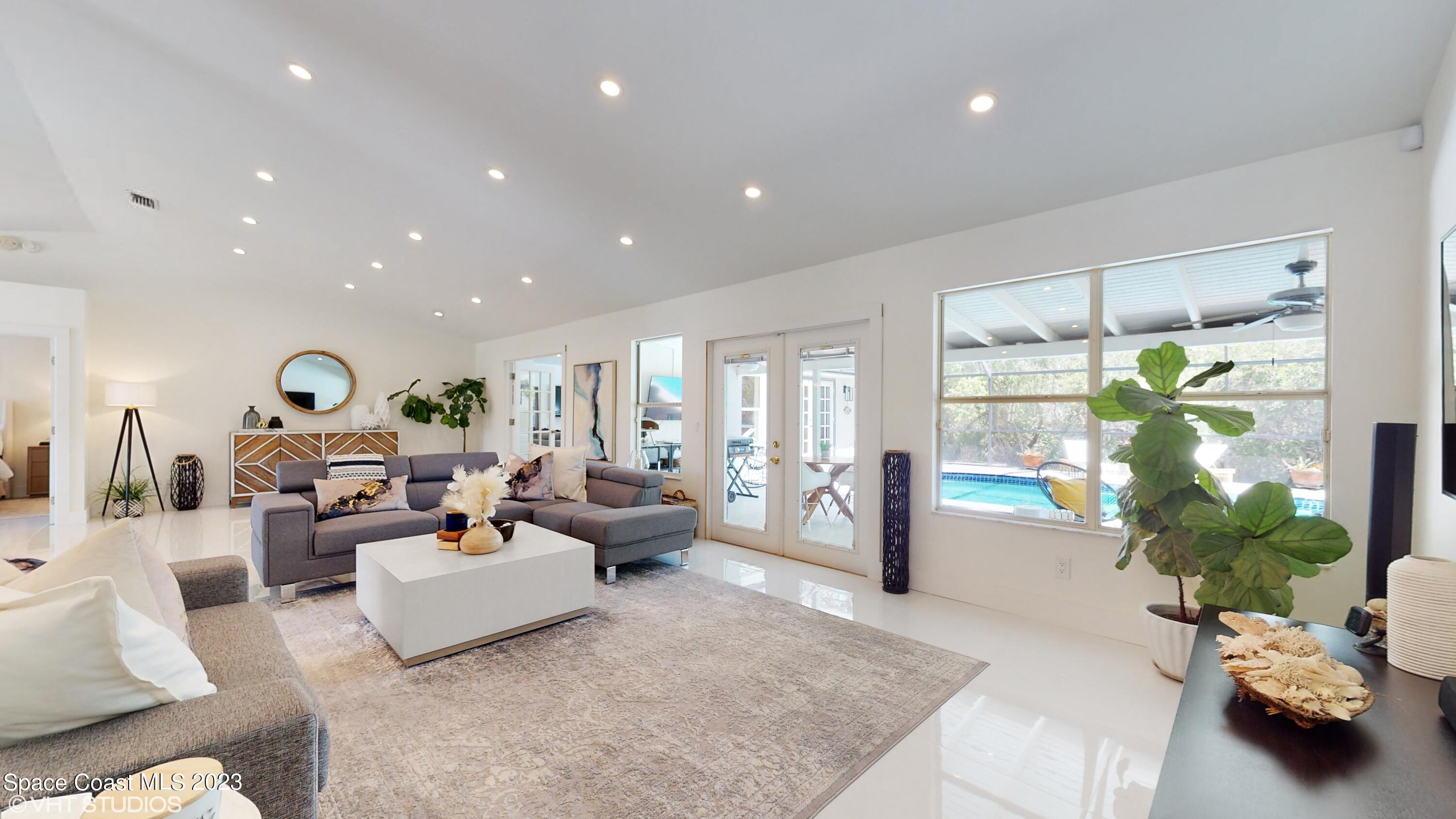 1650 Benjamin Road Malabar, FL 32950 - Photo 7 of 34 a living room with furniture and a large window