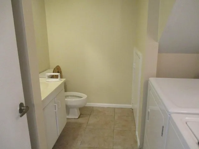 a bathroom with a toilet and a sink