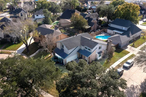 an aerial view of a house with a garden