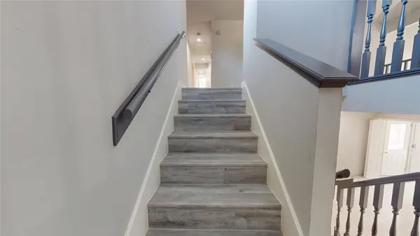 wooden floor in a hall with a window
