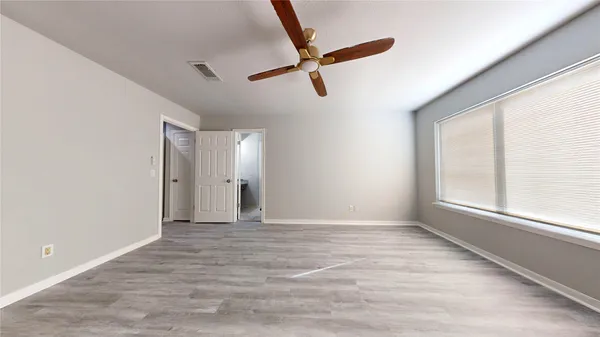 a bathroom with a granite countertop tub sink and mirror