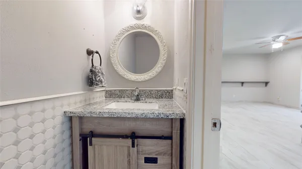 a view of a hallway with staircase