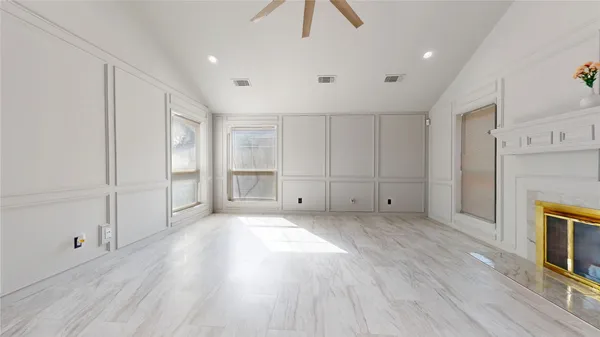a view of an empty room with a fireplace