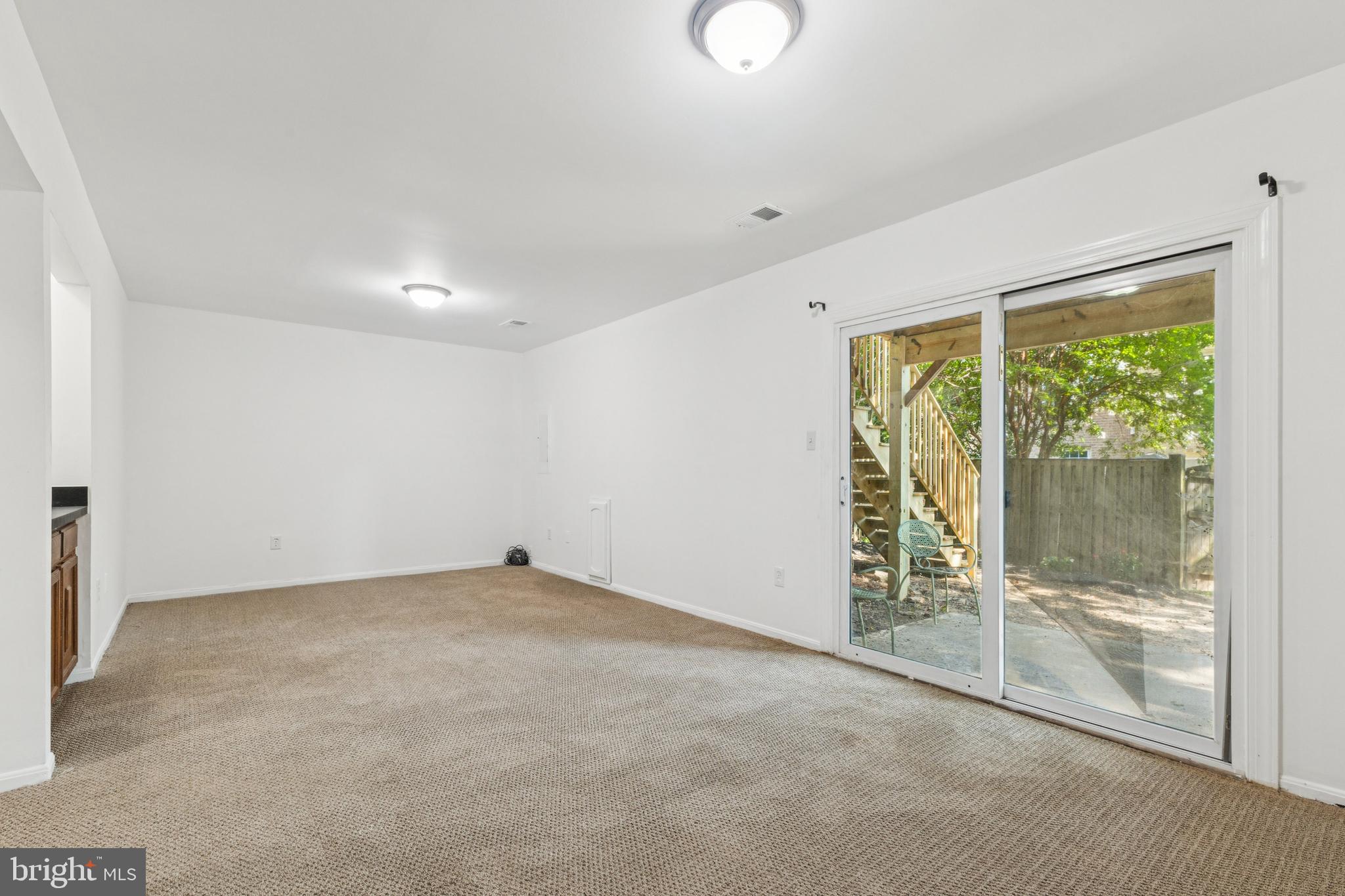10271 Braddock Road Fairfax, VA 22032 - Photo 20 of 25 a view of an empty room with a sliding door