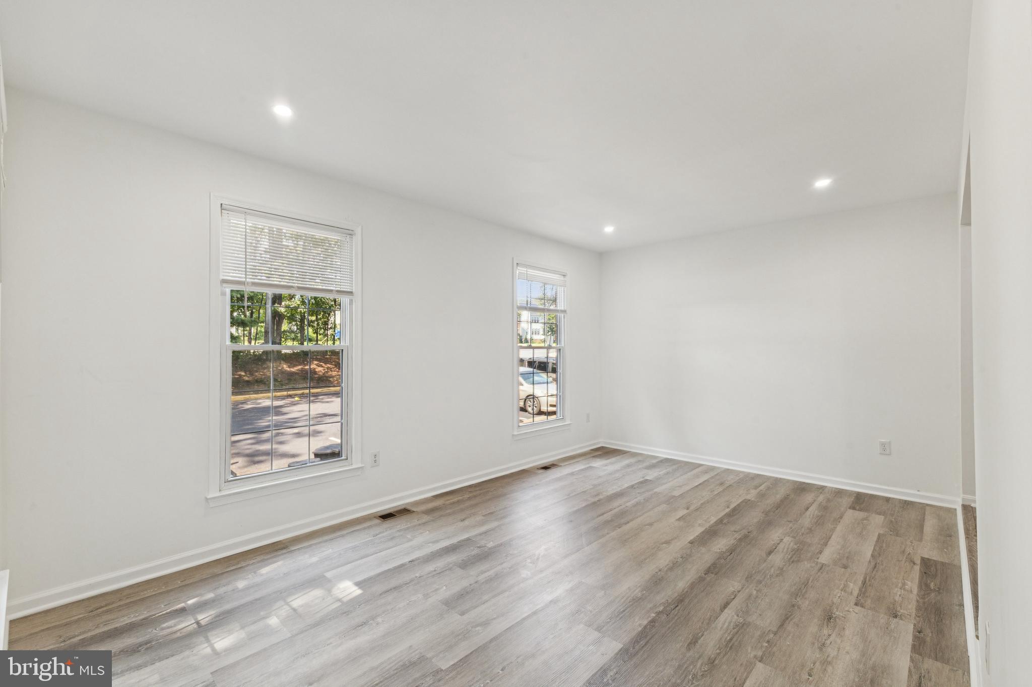 10271 Braddock Road Fairfax, VA 22032 - Photo 4 of 25 wooden floor in an empty room with a window