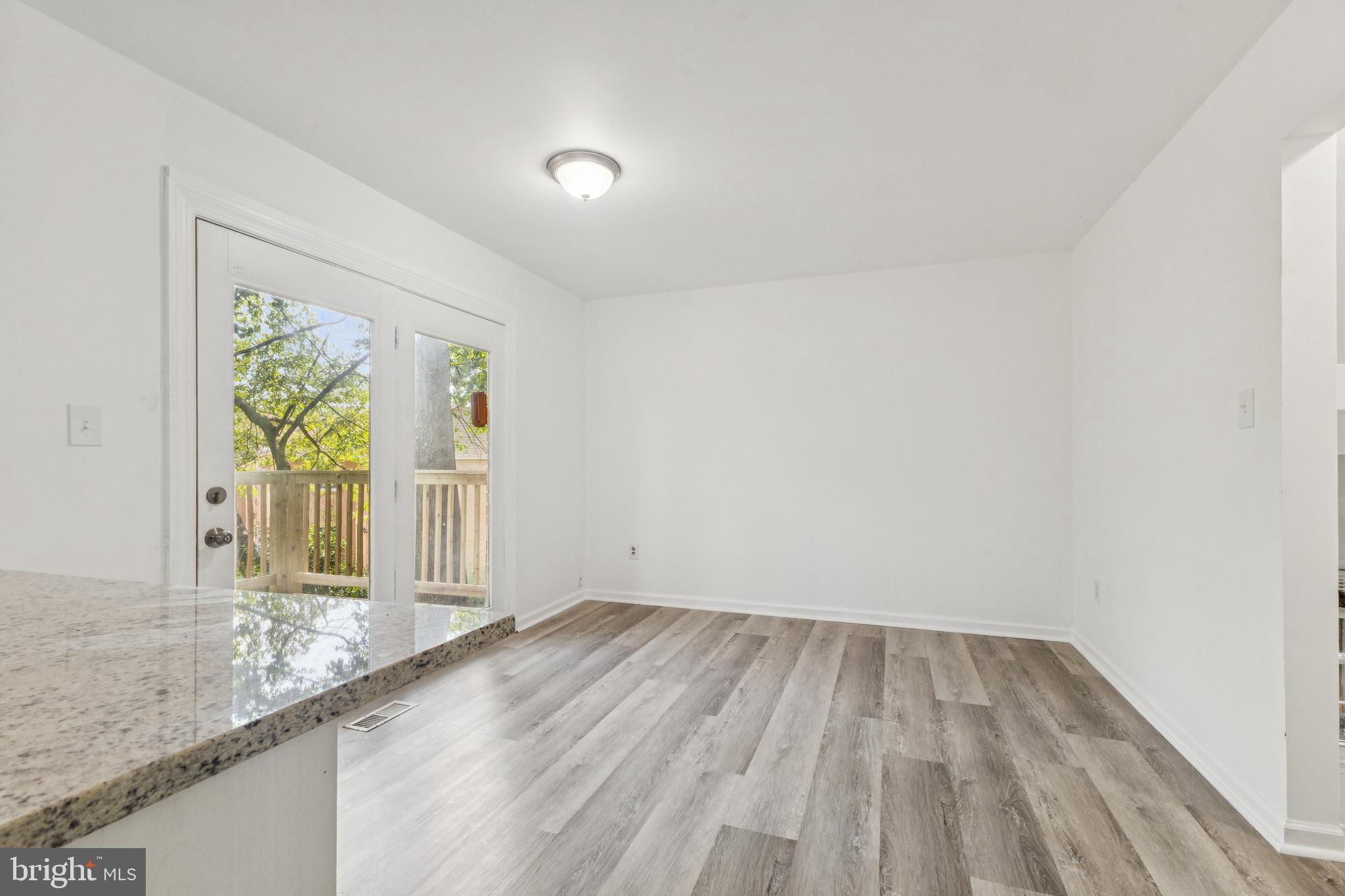 10271 Braddock Road Fairfax, VA 22032 - Photo 7 of 25 a view of a hallway view with wooden floor and a window
