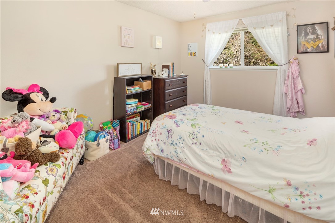 21310 2nd Avenue Southeast Bothell, WA 98021 - Photo 14 of 22 a bedroom with furniture and baby crib