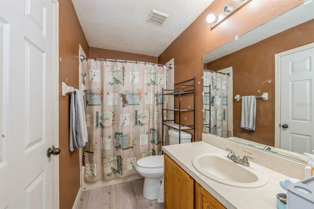 502 Freeman Street Longwood, FL 32750 - Photo 16 of 21 a bathroom with a sink toilet and shower