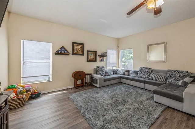a living room with furniture and a window